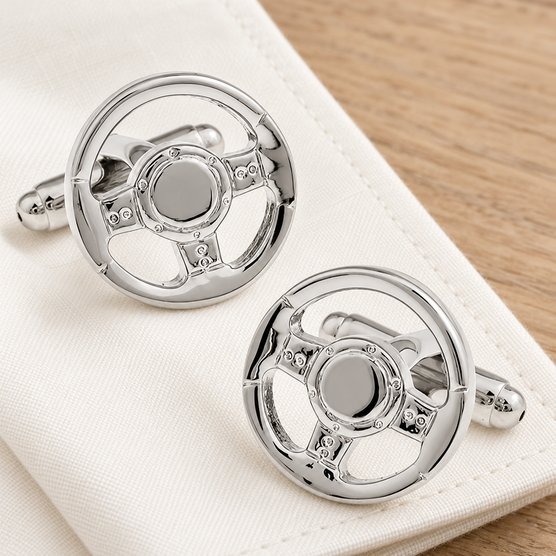 Silver Sports Car Steering Wheel Cufflinks in a muted gift setting