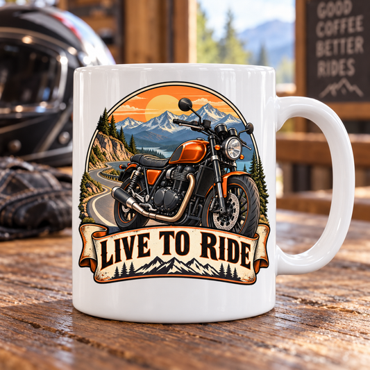 White Live to Ride mug with an orange motorcycle and mountain-road illustration