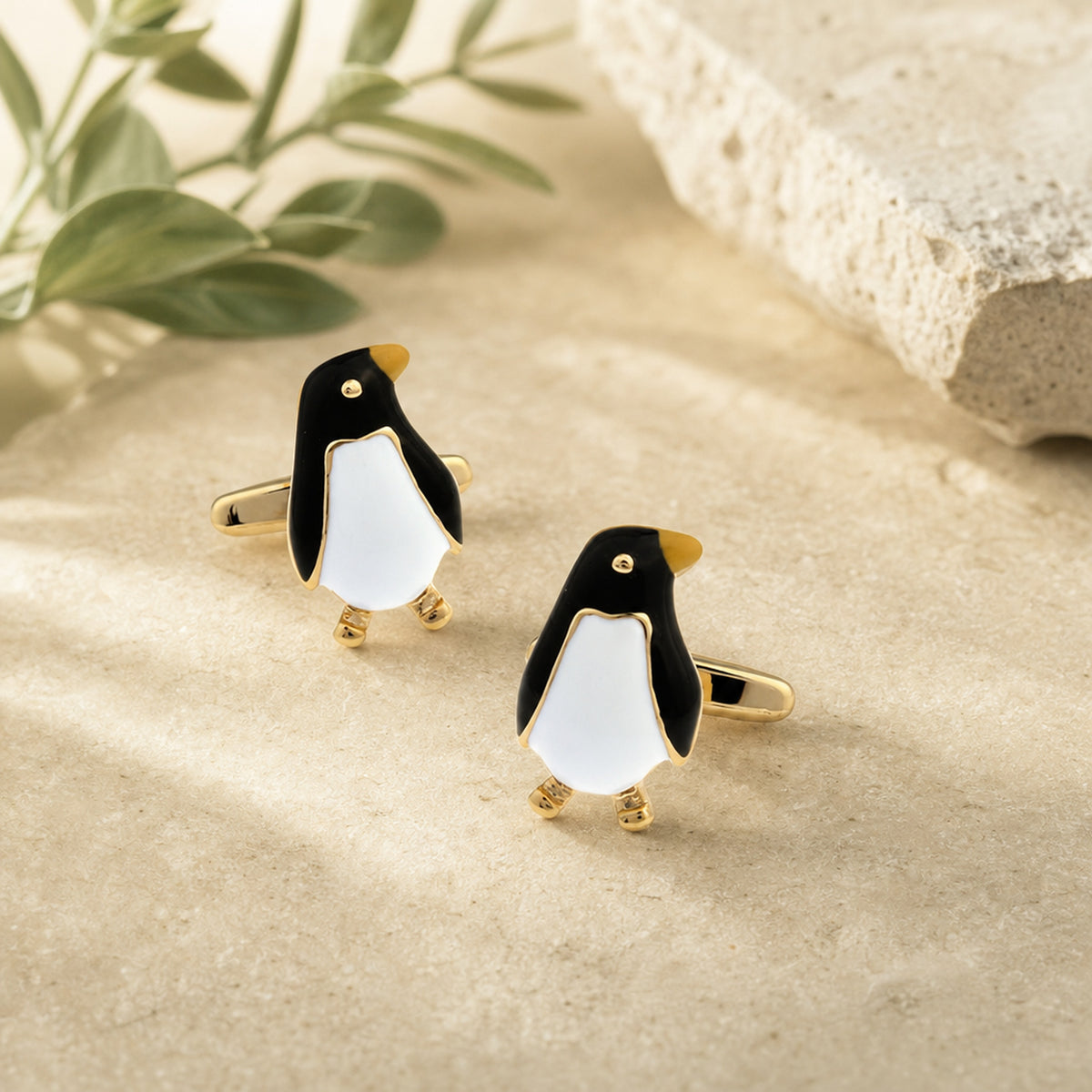 Black And Gold Emperor Penguin Cufflinks in a themed setting