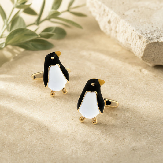 Black And Gold Emperor Penguin Cufflinks in a themed setting