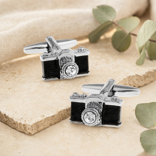 Black And Silver Crystal Lens Camera Cufflinks in a themed setting